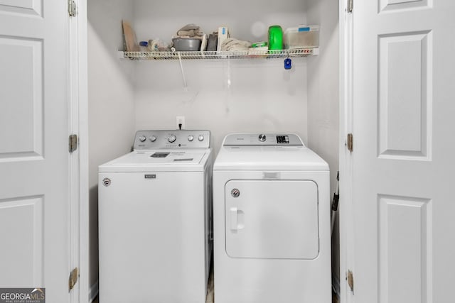 washroom with laundry area and washing machine and clothes dryer