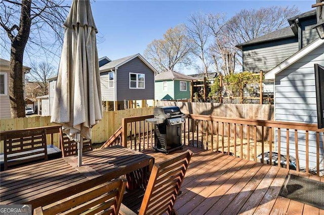 wooden deck with grilling area