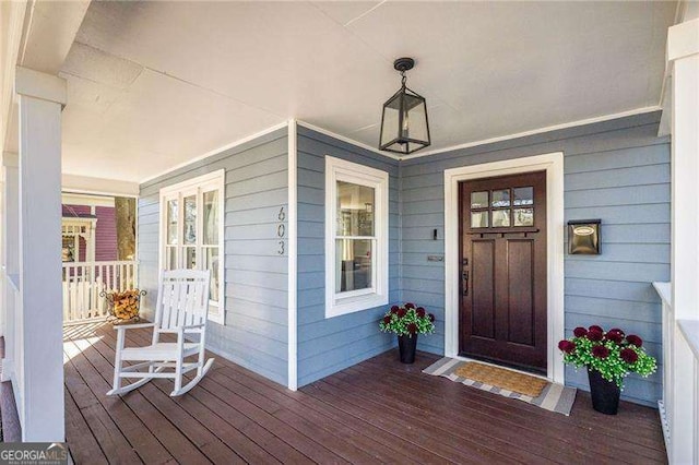 property entrance featuring covered porch