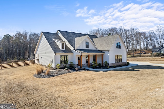 modern farmhouse with a front lawn