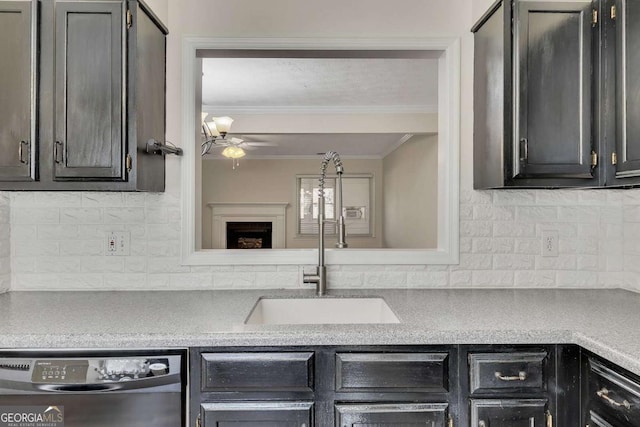 kitchen featuring sink, backsplash, black dishwasher, ceiling fan, and crown molding