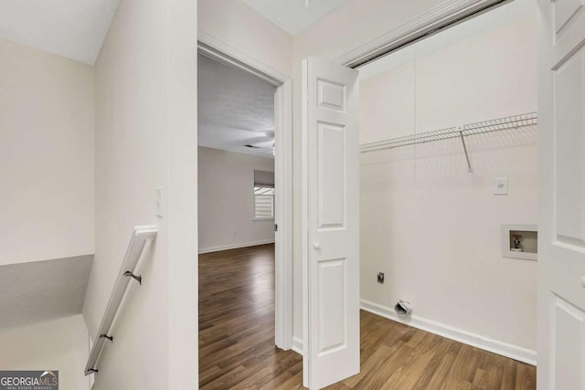 laundry area with hardwood / wood-style flooring, hookup for a washing machine, and electric dryer hookup