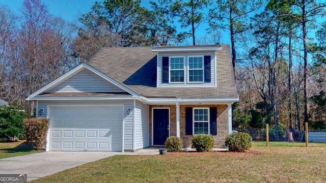 view of front of home featuring a front lawn and a garage