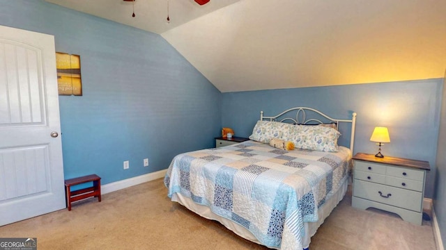 bedroom with ceiling fan, light colored carpet, and lofted ceiling