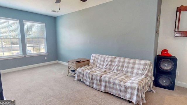 sitting room with light carpet and ceiling fan