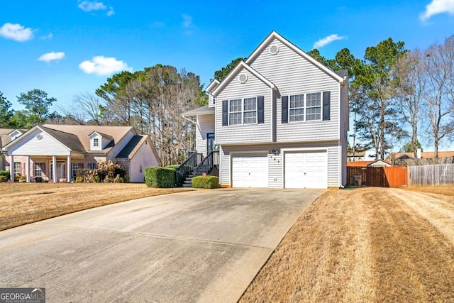 view of front of house featuring a front lawn and a garage