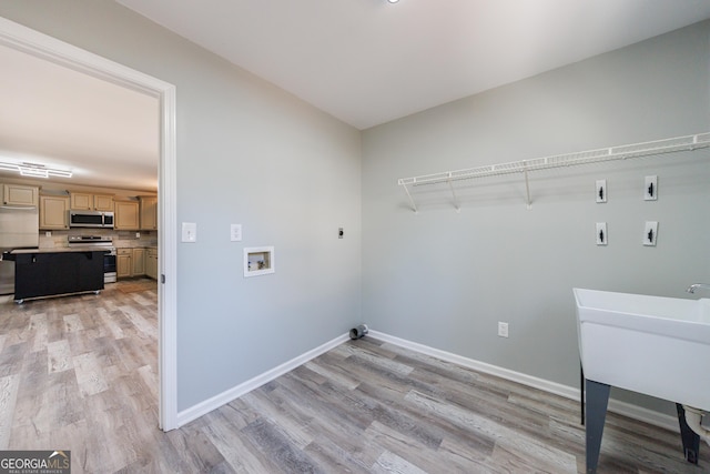 laundry room featuring washer hookup, laundry area, hookup for an electric dryer, and baseboards