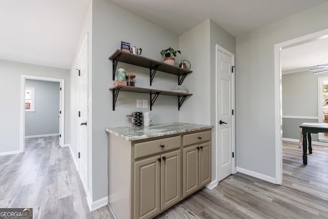 interior space featuring light wood-style floors and baseboards