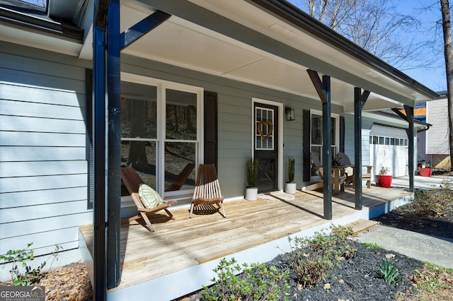 wooden terrace featuring a porch