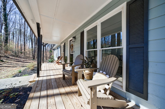 wooden deck featuring covered porch