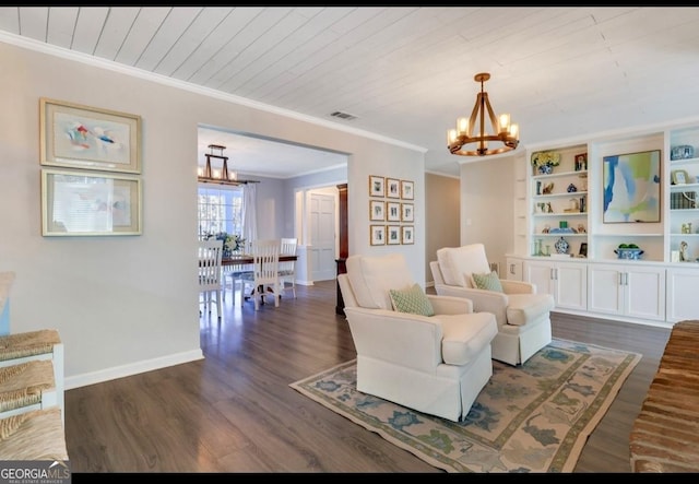 living area featuring ornamental molding, dark wood-type flooring, a chandelier, and wooden ceiling