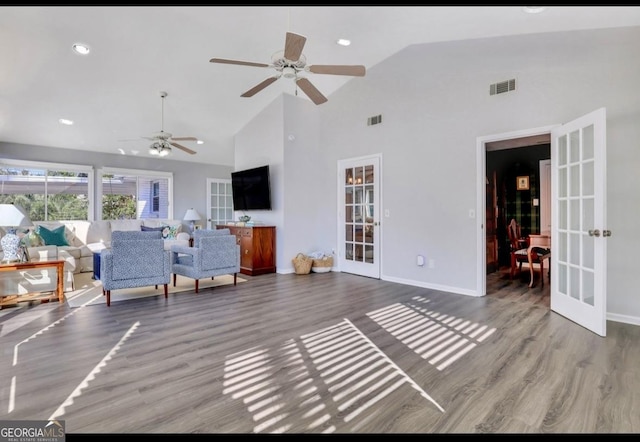 living room with french doors, high vaulted ceiling, ceiling fan, and wood-type flooring