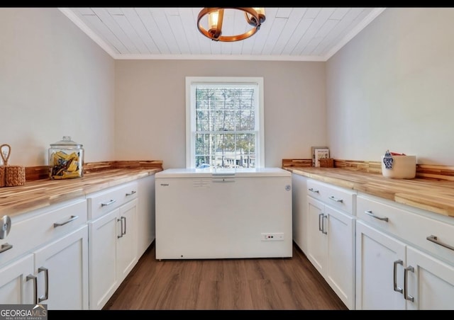 washroom with crown molding, cabinets, dark hardwood / wood-style floors, and wooden ceiling