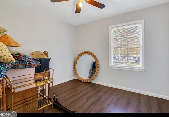 bedroom featuring ceiling fan and dark hardwood / wood-style flooring