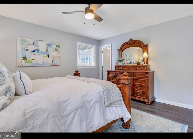 bedroom featuring ceiling fan and dark wood-type flooring