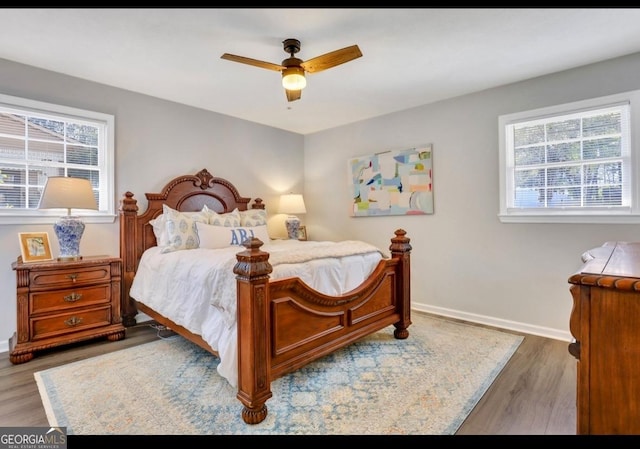 bedroom featuring hardwood / wood-style floors and ceiling fan