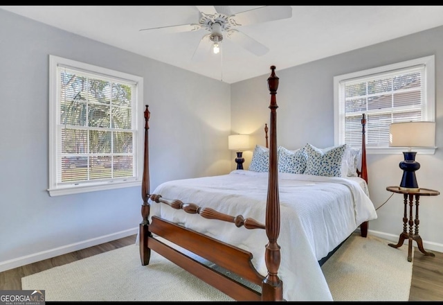 bedroom with hardwood / wood-style flooring and ceiling fan