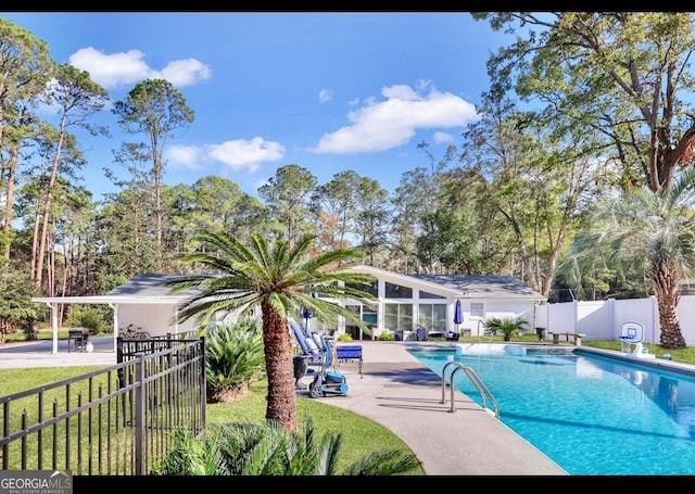 view of swimming pool featuring a patio area