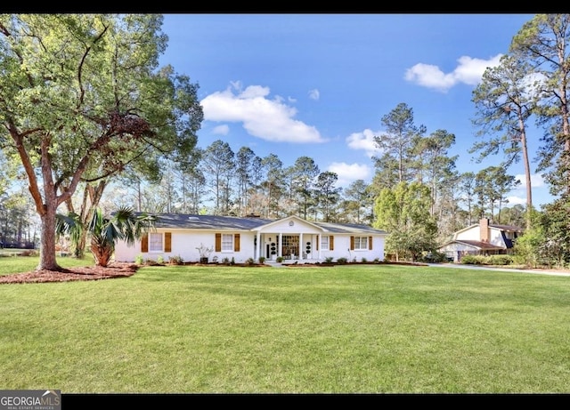 ranch-style house with a front yard