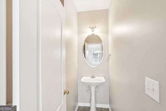 2414 Clock Face Ct, Lawrenceville, GA 30043 - bathroom featuring baseboards and a sink