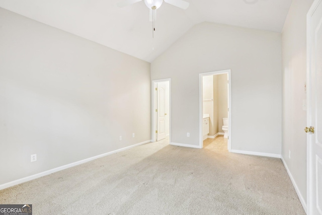 2414 Clock Face Ct, Lawrenceville, GA 30043 - unfurnished bedroom featuring lofted ceiling, light carpet, connected bathroom, and a ceiling fan
