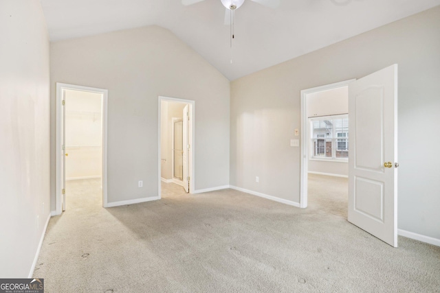 2414 Clock Face Ct, Lawrenceville, GA 30043 - unfurnished bedroom featuring vaulted ceiling, a spacious closet, carpet flooring, and ensuite bath