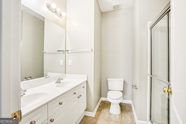 2414 Clock Face Ct, Lawrenceville, GA 30043 - bathroom with double vanity, a shower with door, and tile patterned floors