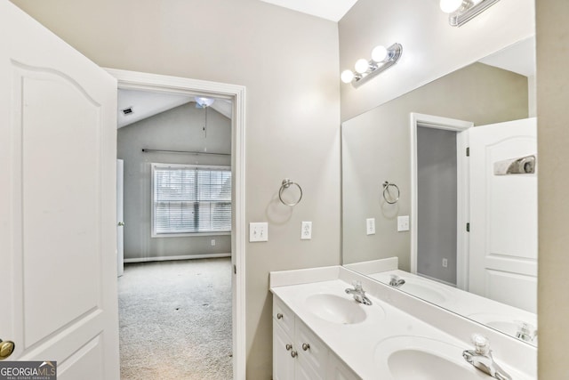 2414 Clock Face Ct, Lawrenceville, GA 30043 - bathroom with double vanity and lofted ceiling