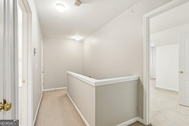 2414 Clock Face Ct, Lawrenceville, GA 30043 - corridor featuring light carpet, an upstairs landing, and attic access