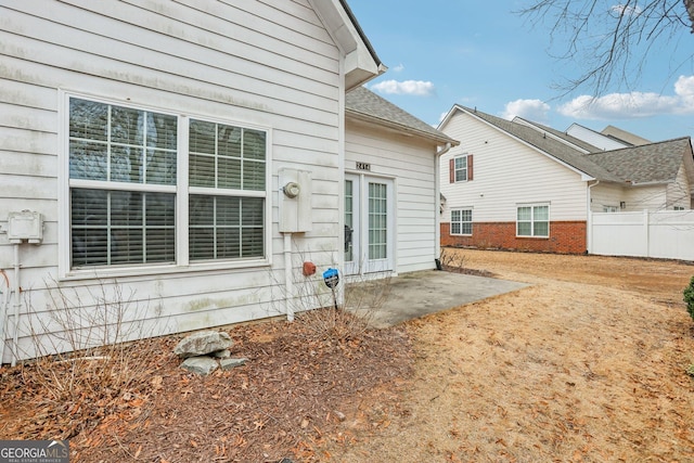 2414 Clock Face Ct, Lawrenceville, GA 30043 - back of property with a patio and roof with shingles