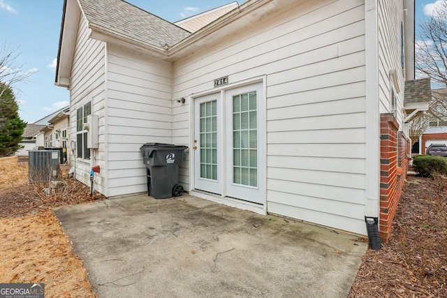 2414 Clock Face Ct, Lawrenceville, GA 30043 - view of side of property featuring roof with shingles and a patio area