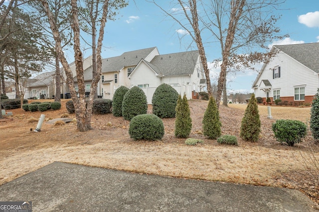 2414 Clock Face Ct, Lawrenceville, GA 30043 - view of side of home featuring a residential view and a chimney