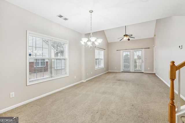 2414 Clock Face Ct, Lawrenceville, GA 30043 - unfurnished room with a chandelier, vaulted ceiling, light carpet, and a ceiling fan
