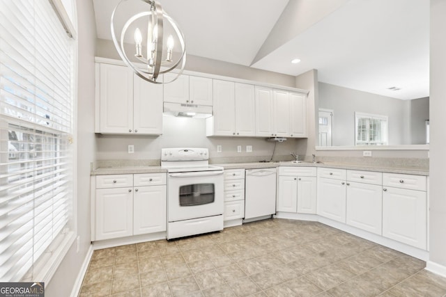 2414 Clock Face Ct, Lawrenceville, GA 30043 - kitchen featuring white appliances, a chandelier, under cabinet range hood, light countertops, and white cabinets