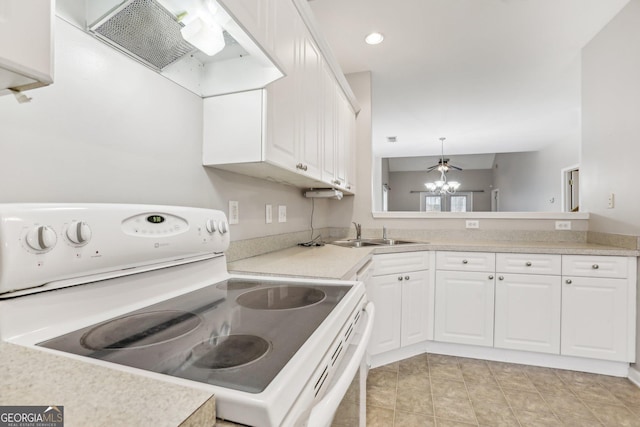 2414 Clock Face Ct, Lawrenceville, GA 30043 - kitchen with electric range, ventilation hood, white cabinetry, light countertops, and recessed lighting