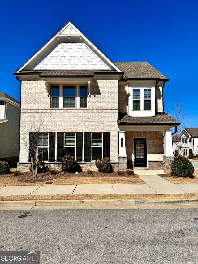 view of front of property featuring brick siding