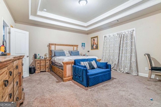 bedroom with a tray ceiling, ornamental molding, and light carpet