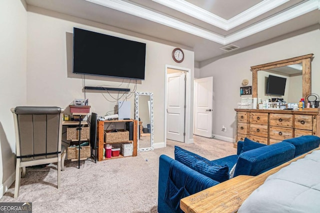 bedroom with a raised ceiling, crown molding, and carpet floors