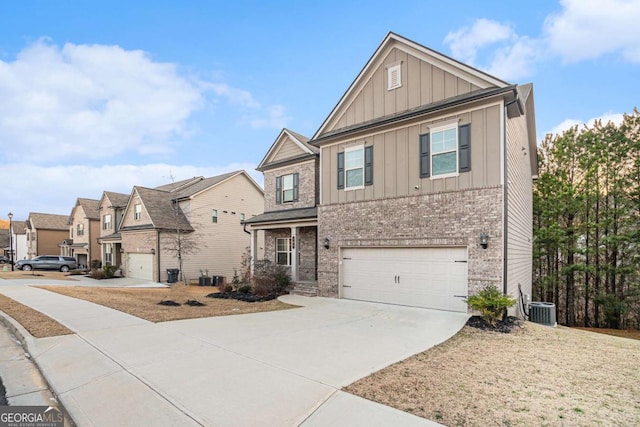 view of front of home featuring a garage and central AC unit