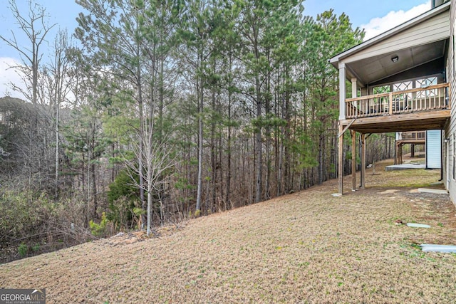 view of yard featuring a wooden deck