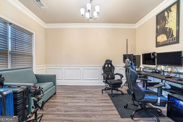 home office with hardwood / wood-style floors, an inviting chandelier, and crown molding