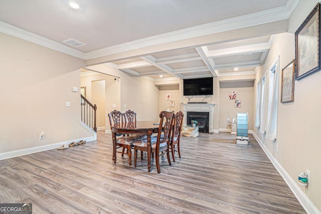 dining room featuring beamed ceiling, crown molding, wood-type flooring, and coffered ceiling