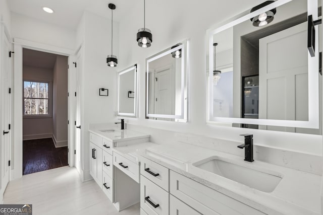 bathroom featuring hardwood / wood-style flooring and vanity