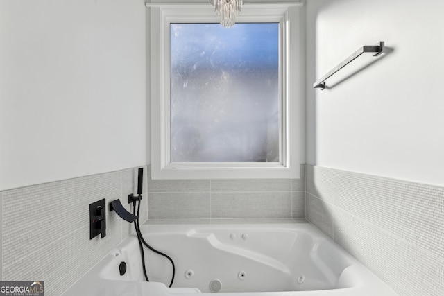 bathroom featuring a washtub