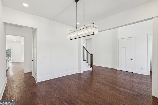 unfurnished dining area featuring dark hardwood / wood-style flooring