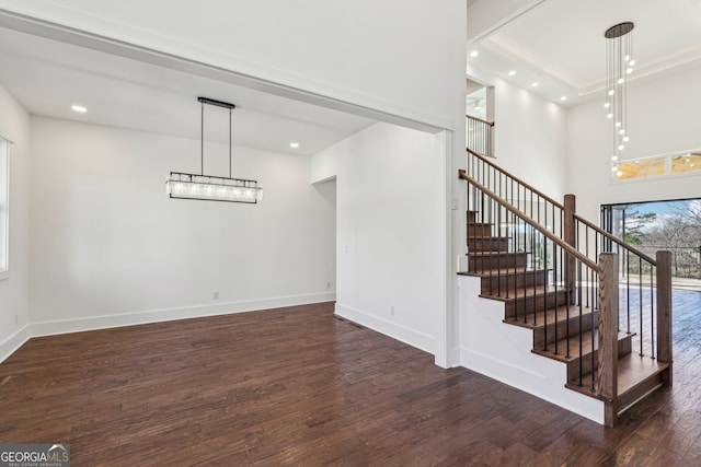 staircase with hardwood / wood-style flooring