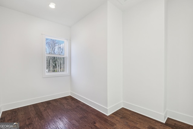 unfurnished room featuring dark hardwood / wood-style floors