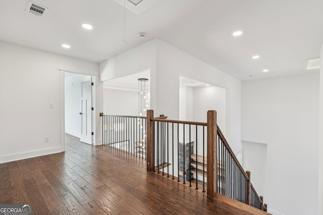 corridor featuring dark hardwood / wood-style floors