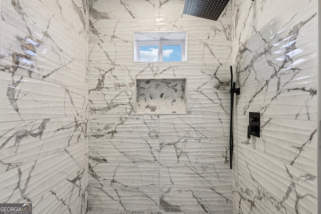 bathroom with a tile shower