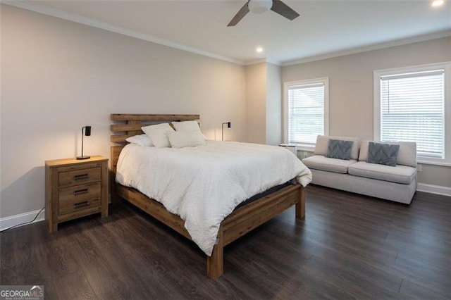 bedroom featuring multiple windows, baseboards, dark wood-style flooring, and ornamental molding